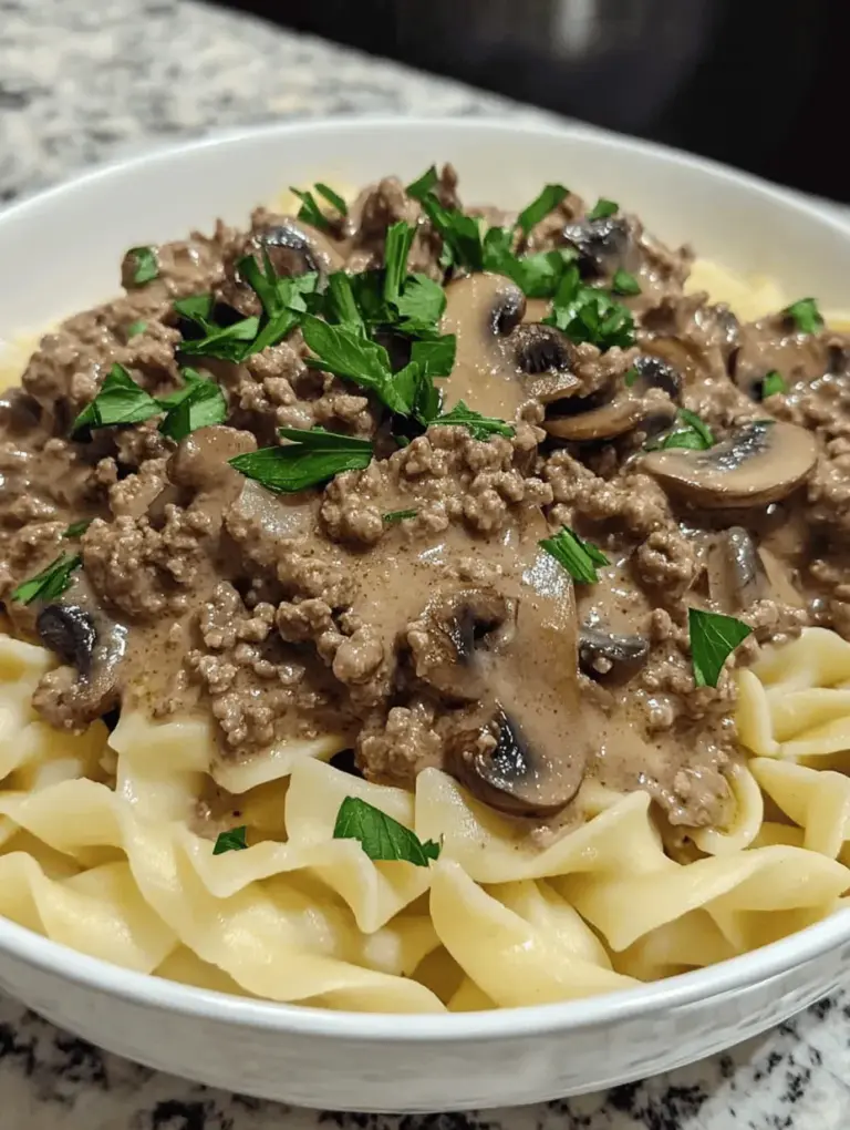 Savory Ground Beef Stroganoff is a classic comfort dish that has warmed the hearts and filled the bellies of families for generations. With its rich flavors and creamy texture, this dish brings a sense of satisfaction that can only come from a home-cooked meal. Imagine tender ground beef simmered with mushrooms and onions in a luscious cream sauce, served over a bed of egg noodles or rice. It's the kind of meal that transforms an ordinary weeknight into something special, making it an ideal choice for busy families and cozy gatherings alike.