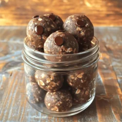 - 1 cup rolled oats - ½ cup creamy peanut butter - ¼ cup honey or maple syrup - ¼ cup unsweetened cocoa powder - ½ cup chocolate chips (dark or semi-sweet) - ¼ cup ground flaxseed (optional) - 1 tsp vanilla extract - A pinch of salt In making Chocolate Peanut Butter Energy Balls, you need simple and wholesome ingredients. Each one serves a purpose and adds to the taste and nutrition. What do these ingredients do? - Rolled oats: They form the base. They give fiber and keep you full. - Creamy peanut butter: It adds rich taste and protein. I love the smooth texture it brings. - Honey or maple syrup: This is your natural sweetener. It binds the mix and adds sweetness. - Cocoa powder: It gives that deep chocolate flavor. It also packs a punch of antioxidants. - Chocolate chips: They add a burst of sweetness. You can use dark or semi-sweet. - Ground flaxseed: This optional ingredient gives extra fiber and omega-3s. It’s a great way to boost nutrition. - Vanilla extract: Just a teaspoon enhances all the flavors. It makes everything taste wonderful. - A pinch of salt: It balances the sweetness. It brings out all the flavors nicely. - Calories per serving: About 150 calories per energy ball. - Protein, fat, and carbohydrate breakdown: Each ball has around 4g protein, 8g fat, and 18g carbs. - Health benefits of key ingredients: - Oats help with digestion and provide lasting energy. - Peanut butter is a good source of protein and healthy fats. - Cocoa powder offers antioxidants and may improve mood. - Flaxseed adds fiber, promoting heart health. The combination of these ingredients makes the energy balls not just tasty but also a nutritious snack. If you want to see the full recipe, check out the section above. First, you need to mix the oats, cocoa powder, and flaxseed in a large bowl. This step is key. It ensures that the dry ingredients blend well. If you use flaxseed, it adds fiber and omega-3s. Balancing dry ingredients helps the energy balls hold together. Next, grab another bowl and combine peanut butter, honey or maple syrup, and vanilla extract. Stir well until everything is smooth. This part is important for getting the right consistency. If the mixture is too thick, it won’t blend well with the dry ingredients. Now, it’s time to form the energy balls. Use your hands to scoop out small portions. Aim for about one inch in diameter. Rolling them tightly helps them stay firm. After shaping, place the balls on a lined baking sheet. Refrigerate for about 30 minutes to set. This step makes them easier to eat and enhances their flavor. For the complete recipe, check the Full Recipe section. To make the best energy balls, aim for a thick and slightly sticky dough. You want it to hold together well but not be too wet. If it feels dry, add a touch more peanut butter or honey. If it's too wet, mix in a bit more oats. I recommend using a sturdy spatula for mixing. It helps combine everything well without too much effort. For best freshness, store your energy balls in an airtight container. They keep well in the fridge for up to a week. To extend their shelf life, you can freeze them. Just place them in a freezer-safe bag or container. They will last for about three months in the freezer. When you want to enjoy them, let them thaw in the fridge overnight. To make your energy balls look appealing, arrange them in a mason jar or on a nice plate. You can also dust them with cocoa powder for a fancy touch. Pair these energy balls with a glass of milk or a warm cup of tea. They also taste great with fresh fruit or yogurt for a balanced snack. Feel free to explore the [Full Recipe] for more ideas! {{image_2}} You can easily change the flavor of your energy balls. Adding spices like cinnamon or nutmeg gives them warmth and depth. Just a pinch can make a big difference. You can also swap peanut butter for almond or cashew butter. Each nut has its own unique taste. This lets you create a special twist to fit your mood. Texture can change how we enjoy food. Incorporating crunchy nuts or seeds adds a fun bite. Chopped almonds or sunflower seeds work great. You can also use different types of chocolate. Dark chocolate offers a rich taste, while milk chocolate is sweeter. These small changes can make your energy balls exciting every time. Dietary needs vary for everyone. To make these energy balls gluten-free, just use gluten-free oats. You can also make them vegan by swapping honey for maple syrup. This keeps the sweetness while meeting dietary needs. If you want lower sugar, try using stevia or monk fruit sweetener. These options help you enjoy a tasty treat without the extra sugar. Chocolate peanut butter energy balls last about one week in the fridge. Keep them in an airtight container to maintain freshness. If stored properly, they stay tasty and safe to eat. Refrigeration helps firm up the energy balls. This makes them easier to handle and enjoy. To freeze energy balls, place them in a single layer on a baking sheet. Make sure they are not touching. Freeze them for about an hour. Once frozen, transfer them to a freezer-safe container or bag. When you want to eat one, thaw it in the fridge overnight. This helps keep the flavor and texture just right. I recommend using glass jars or plastic containers with tight lids. These types of containers keep air out and help maintain freshness. Airtight sealing is key to stopping moisture and odors. Always label your containers with the date you made the energy balls. This way, you know how long they have been stored. Chocolate peanut butter energy balls last about one week in the fridge. They stay fresh in an airtight container. If you freeze them, they can last up to three months. Just make sure to thaw them in the fridge before enjoying. Yes, you can easily customize the ingredients! Here are a few ideas: - Swap creamy peanut butter for almond or cashew butter. - Add dried fruits like cranberries or raisins for sweetness. - Mix in seeds such as chia or pumpkin for extra crunch. - Use different types of chocolate chips, like white or butterscotch. Energy balls are a great snack! They offer several health benefits, such as: - Good source of energy from oats and peanut butter. - Packed with protein, which helps keep you full. - Healthy fats from peanut butter support brain health. - Cocoa powder adds antioxidants, which are good for your body. Yes, you can make energy balls without honey! You can use maple syrup or agave nectar as a sweetener. If you prefer less sweetness, consider using mashed banana or unsweetened applesauce. For the full recipe, check out the main section. These chocolate peanut butter energy balls are easy to make and loaded with nutrients. We covered the key ingredients, from oats to chocolate chips, and discussed their health perks. I shared step-by-step instructions for mixing and shaping them, plus valuable tips for storage and flavor variations. Remember, you can customize this recipe to fit your taste and dietary needs. Enjoy your tasty, energy-boosting snacks!