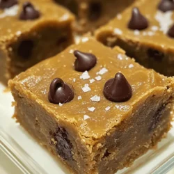 - 1 cup cookie butter: This is the star of the show. It adds a rich, sweet flavor. - 1/2 cup unsalted butter, melted: This keeps the blondies moist and adds richness. - 1 cup brown sugar, packed: Brown sugar gives a deeper flavor and chewiness. - 1/4 cup granulated sugar: This adds sweetness and helps with the texture. - 2 large eggs: Eggs bind the ingredients and add moisture. - 1 teaspoon vanilla extract: This enhances the flavor of the blondies. - 1 1/2 cups all-purpose flour: Flour is the base for the blondies’ structure. - 1/2 teaspoon baking powder: This helps the blondies rise a bit. - 1/4 teaspoon baking soda: It adds a touch of lift and lightness. - 1/4 teaspoon salt: Salt balances the sweetness and enhances flavors. - 1/2 cup chocolate chips (optional): These add extra sweetness and texture. - Sea salt, for sprinkling on top: A pinch on top boosts the flavor. These ingredients come together to create a warm, gooey treat. You can find the full recipe [here]. 1. First, preheat your oven to 350°F (175°C). This helps your blondies bake evenly. 2. Next, grease a 9x9-inch baking pan or use parchment paper. This step makes it easy to lift the blondies out later. 3. In a large mixing bowl, combine 1 cup of cookie butter and 1/2 cup of melted unsalted butter. Mix until smooth. 1. Now, whisk in 1 cup of brown sugar and 1/4 cup of granulated sugar. Keep mixing until it blends well. 2. Add 2 large eggs one at a time, beating well after each. Then stir in 1 teaspoon of vanilla extract. 3. In a separate bowl, whisk 1 1/2 cups of all-purpose flour with 1/2 teaspoon of baking powder, 1/4 teaspoon of baking soda, and 1/4 teaspoon of salt. 4. Gradually add the dry mix to the wet mix. Stir gently until combined. Don’t overmix; the batter should be thick and creamy. 1. If you want to add chocolate chips, fold in 1/2 cup now. This step is optional but adds a nice touch. 2. Pour the batter into your prepared pan, spreading it evenly. 3. Sprinkle a pinch of sea salt on top for extra flavor. 4. Bake for 25-30 minutes. The edges should look golden, and a toothpick should come out clean. 5. After baking, cool in the pan for 10 minutes. Then transfer to a wire rack to cool completely. 6. Once cooled, cut into squares and enjoy your delicious cookie butter blondies. For detailed measurements and additional notes, check the Full Recipe. To get the best blondies, focus on mixing. Overmixing can make them tough. Combine the wet and dry ingredients gently. Stop mixing as soon as you see no dry flour. This keeps your blondies soft and chewy. Next, baking evenly is key. Make sure your oven is preheated to 350°F (175°C). Use a 9x9-inch pan to let the heat circulate well. If the edges cook faster than the center, rotate the pan halfway through baking. This helps everything cook just right. Cookie butter comes in many flavors. Try different kinds to change your blondies. Some have spices, while others are sweeter. Each type offers a unique taste. This is a fun way to experiment! For mix-ins and toppings, think about what you love. Chocolate chips add richness. Nuts give a nice crunch. Dried fruit can add sweetness and chewiness. Sea salt on top boosts flavor. Choose what fits your taste best. For the full recipe, check out the detailed instructions above. {{image_2}} You can change up your cookie butter blondies easily. Adding nuts gives a nice crunch. I love using chopped walnuts or pecans. You can also add fruit for a fresh twist. Try throwing in some chopped apples or dried cranberries. These flavors can mix well with the sweetness of cookie butter. Swapping chocolate chips is another fun option. You can use white chocolate chips or butterscotch chips instead. Each swap will give the blondies a new taste. You could even use peanut butter chips for extra flavor. Experimenting with different flavors keeps things exciting in the kitchen. If you need gluten-free options, use almond flour or a gluten-free flour blend. These work well in this recipe and keep the blondies tasty. You can also try oat flour for a different texture. For vegan adaptations, you can replace eggs with flaxseed meal or applesauce. Use one tablespoon of flaxseed mixed with three tablespoons of water for each egg. This makes a great binding agent. Applesauce works too, giving the blondies moisture. These swaps mean everyone can enjoy cookie butter blondies. For the full recipe, check the original section above. Store your cookie butter blondies at room temperature. Use an airtight container to keep them fresh. They will stay good for about three days. If you want them to last longer, consider refrigerating them. In the fridge, they can last for a week. Just let them sit out for a bit before eating. This helps bring back their soft texture. To freeze your blondies, cut them into squares first. Wrap each piece tightly in plastic wrap. Then, place them in a freezer bag or container. This keeps them from getting freezer burn. They can stay frozen for up to three months. When you’re ready to eat them, take out how many you want. Let them thaw in the fridge overnight. If you want to warm them up, you can use the microwave. Heat them for 10-15 seconds. This makes them soft and gooey again. Enjoy your cookie butter blondies at their best! For the full recipe, check out the link above. Can I use crunchy cookie butter instead of smooth? Yes, you can use crunchy cookie butter. It adds extra texture. The blondies will still taste great. The bits of cookie will create a fun surprise in each bite. How long will the blondies last? Cookie butter blondies last about 3 to 5 days at room temperature. Store them in an airtight container. They can also last longer in the fridge, about a week. Why are my blondies too dry? Dry blondies usually come from overbaking. Keep an eye on the oven timer. Check them a few minutes early. If the edges are golden and a toothpick comes out with a few crumbs, they are done. What to do if my blondies stick to the pan? If your blondies stick, you might not have greased the pan enough. Always grease or line your pan with parchment paper. This helps with easy removal. If they still stick, let them cool longer before trying to lift them out. Best pairings for cookie butter blondies These blondies pair well with coffee or milk. You can also serve them with hot chocolate. They taste great alongside a scoop of vanilla ice cream. Ideas for serving with ice cream or sauces Drizzle warm caramel or chocolate sauce over the blondies. Top with a scoop of ice cream for a yummy treat. You can also sprinkle some sea salt to enhance the flavors even more. For the full recipe, check the earlier sections in this article. You now know how to make delicious cookie butter blondies from scratch. We covered the key ingredients, step-by-step baking, and tips for great texture and flavor. Don't forget the many variations for special diets or fun mix-ins. Store these treats well for later enjoyment. With this knowledge, you're ready to impress friends and family. Baking can be fun and rewarding. Enjoy every bite and happy baking!